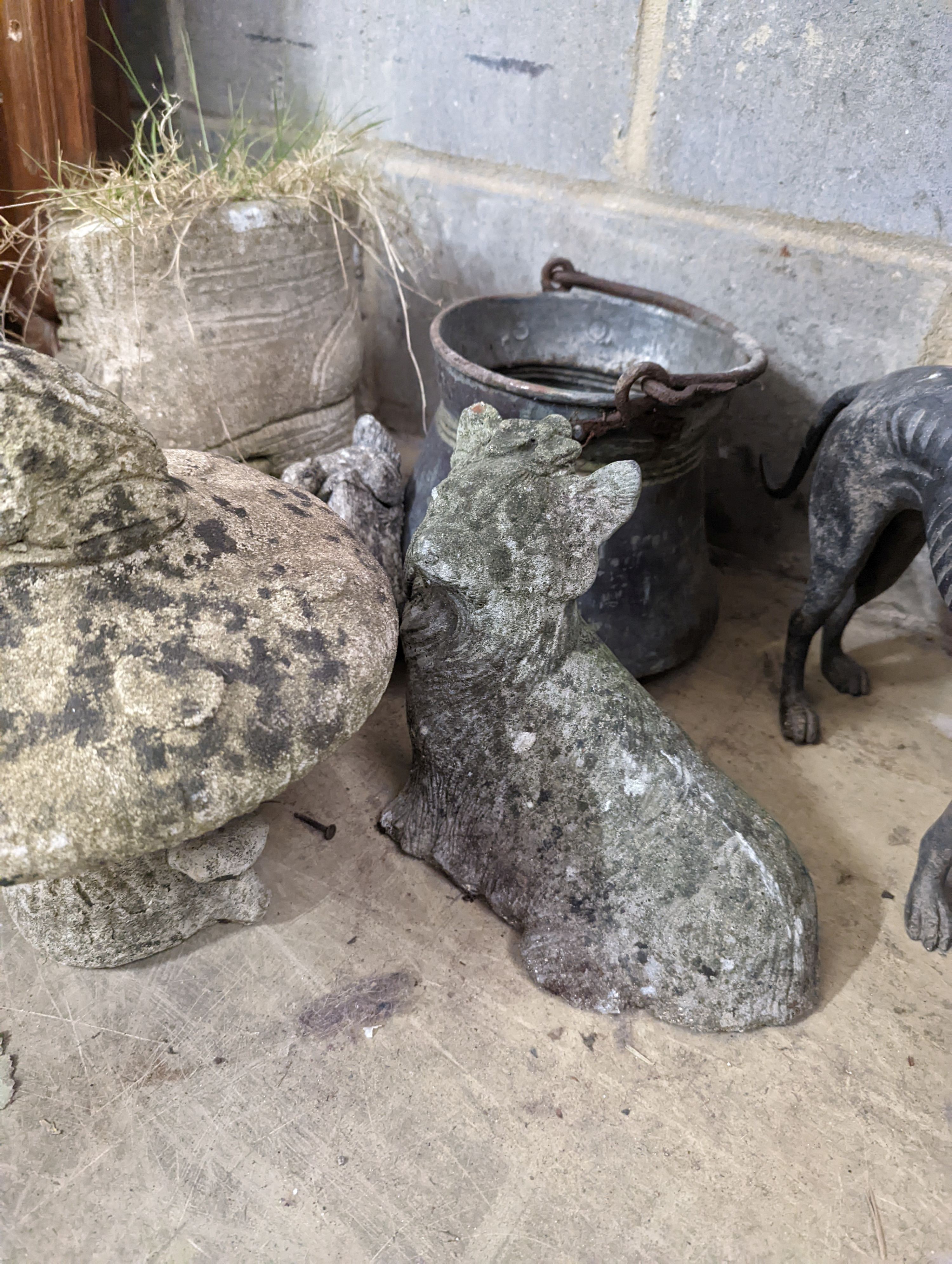 A spelter greyhound, metal pail and four garden ornaments, largest width 34cm